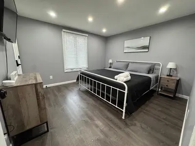 a bedroom with a bed and a window at Casa Rosado @ Pocono II by Lake Hot Tub Camelback in Tobyhanna