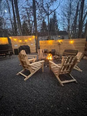 a group of chairs and a fire pit in a yard at Casa Rosado @ Pocono II by Lake Hot Tub Camelback in Tobyhanna