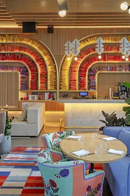 a dining room with a table and chairs at Virgin Hotels New York City in New York