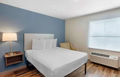 a bedroom with a white bed and a window at Extended Stay America Suites - Philadelphia - Plymouth Meeting - West in Plymouth Meeting