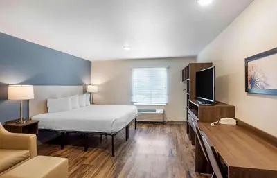 a hotel room with a bed and a tv at Extended Stay America Suites - Philadelphia - Plymouth Meeting - West in Plymouth Meeting