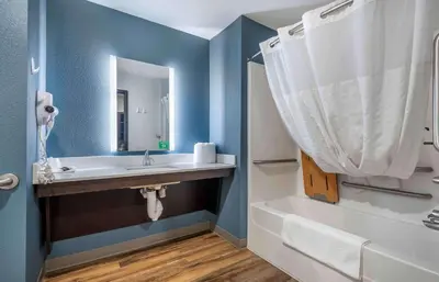 a bathroom with a sink and a tub and a mirror at Extended Stay America Suites - Philadelphia - Plymouth Meeting - West in Plymouth Meeting