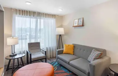 a living room with a couch and a chair at Extended Stay America Suites - Philadelphia - Plymouth Meeting - West in Plymouth Meeting
