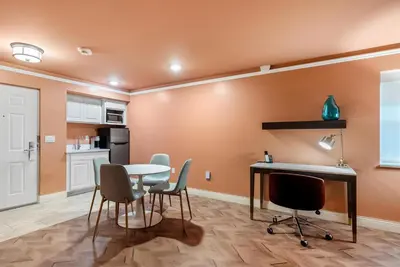 a kitchen and dining room with a table and chairs at The Inn at Lewisburg, BW Signature Collection in Lewisburg
