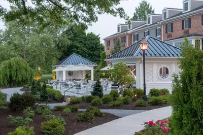 a garden in front of a building with a gazebo at The Inn at Lewisburg, BW Signature Collection in Lewisburg