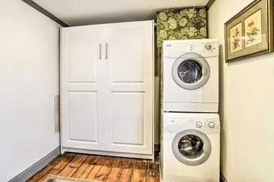 a white laundry room with a washer and dryer at Historic Home with Garden Walk to Center City! in Philadelphia