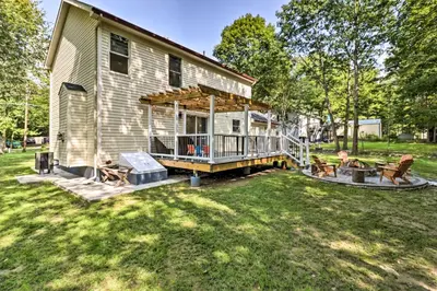 a house with a porch and a deck at Game Room and Yard Family Paradise in Pocono Summit in Pocono Summit Estates