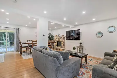 a living room with two couches and a dining room at Game Room and Yard Family Paradise in Pocono Summit in Pocono Summit Estates
