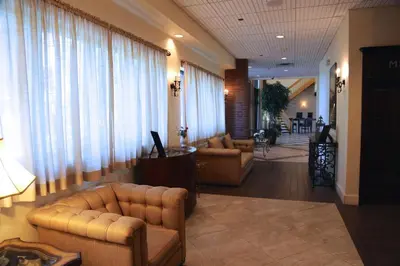 a living room with couches and chairs in a lobby at Best Western Plus Fairfield Executive Inn in Fairfield