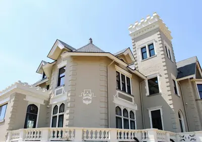 a large house with a white fence at Wilbur Mansion in Bethlehem
