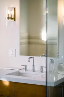 a bathroom with a white sink and a mirror at Wilbur Mansion in Bethlehem