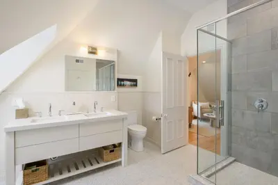a bathroom with a sink and a toilet and a shower at Wilbur Mansion in Bethlehem