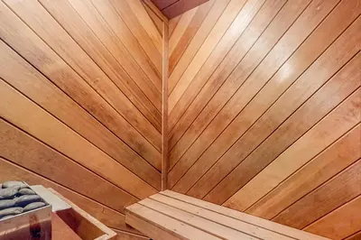 a wooden wall in a sauna with wood paneling at The Cabin in Pocono Summit