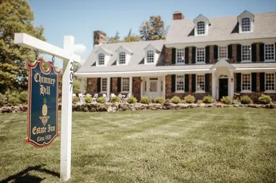 a sign in front of a large house at Chimney Hill Estate Inn in Lambertville