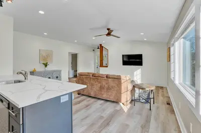 a kitchen and living room with a couch at Chimney Hill Estate Inn in Lambertville