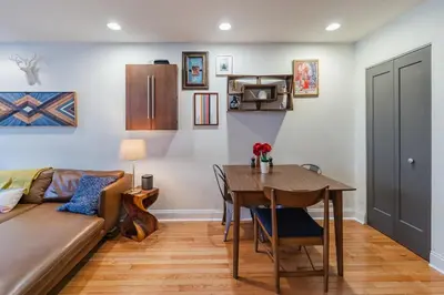 a living room with a couch and a table at Bedroom in thoughtfully decorated East Passyunk home (South Philadelphia) in Philadelphia