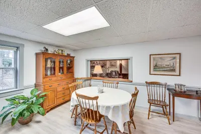 a dining room with a table and chairs at Amish Country Apartment with Cozy Fireplace! in New Holland