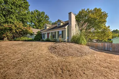 a house with a large pile of dirt in front of it at Amish Country Apartment with Cozy Fireplace! in New Holland