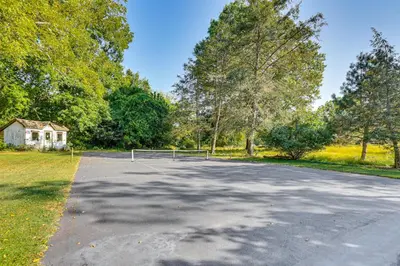 an empty parking lot in front of a house at 3-Acre Property Charming Dutch Country Colonial in Reading