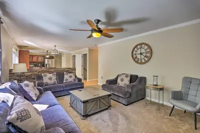 a living room with couches and a ceiling fan at Hot Tub, Fire Pit and Lake Access Poconos Escape! in Albrightsville