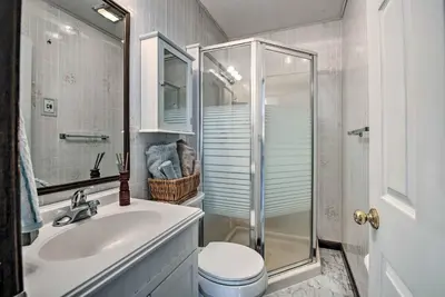 a bathroom with a toilet and a sink and a shower at Charming Lewisburg Home with Hot Tub and Games! in Lewisburg