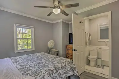 a bedroom with a bed and a ceiling fan at Stunning South Fallsburg Home with Pool and Deck! in South Fallsburg
