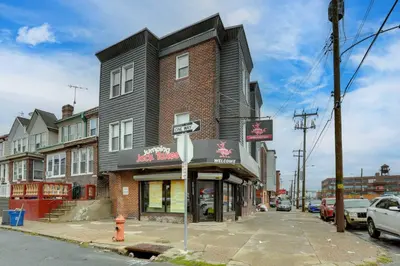 a building on the corner of a city street at Philadelphia Apartment, Near Transit and Sites! in Philadelphia