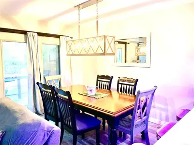 a dining room with a wooden table and chairs at Big Boulder Lake and Ski!!!! in Lake Harmony