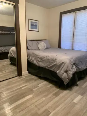 a bedroom with a bed and a large mirror at Big Boulder Lake and Ski!!!! in Lake Harmony