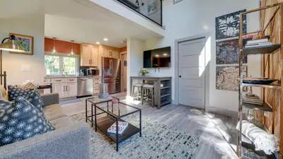 a living room with a couch and a table at A newly built Tiny House in the center of Historic Kennett Square in Kennett Square