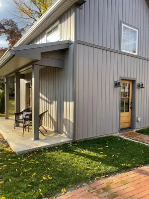 a side view of a house with a patio at A newly built Tiny House in the center of Historic Kennett Square in Kennett Square