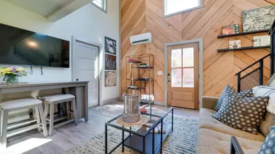 a living room with a couch and a table at A newly built Tiny House in the center of Historic Kennett Square in Kennett Square