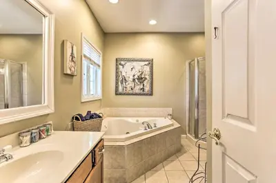 a bathroom with a tub and a sink at Pet-Friendly Grand Pine Bush Retreat on 2 Acres! in Pine Bush