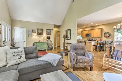 a living room with a couch and chairs and a kitchen at Pet-Friendly Grand Pine Bush Retreat on 2 Acres! in Pine Bush