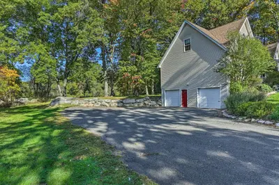 a house with a driveway with a garage at Pet-Friendly Grand Pine Bush Retreat on 2 Acres! in Pine Bush