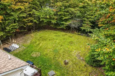an aerial view of a yard with grass and trees at Tree and Easy in Tobyhanna