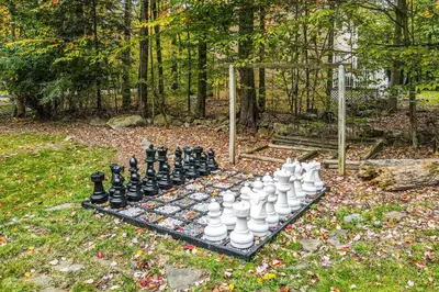 a chess board with chessetts on it in a park at Tree and Easy in Tobyhanna