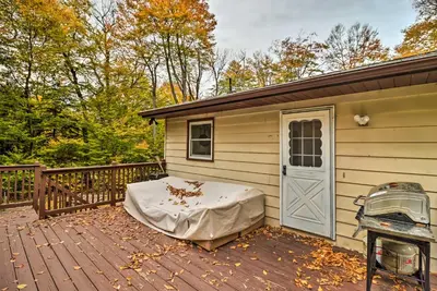 a small house with a mattress on a deck at 12 Mi to Camelback Ski Resort Home with Decks! in Tobyhanna