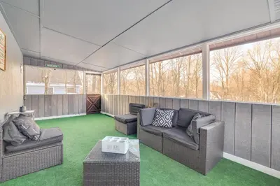 a living room with two couches and a table at Less Than 7 Mi to Slopes Inviting Pocono Mtn Retreat! in Albrightsville