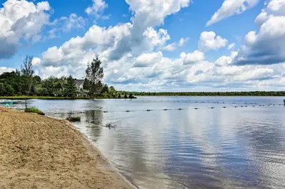 a lake with ducks swimming in the water at Less Than 7 Mi to Slopes Inviting Pocono Mtn Retreat! in Albrightsville