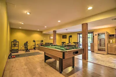 a room with a pool table in a house at Pool, Games and Sauna Mount Joy Countryside Cabin in Mount Joy