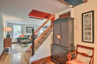 a staircase in a living room with a stair case at Historic Home in Lambertville Walk to Bridge in Lambertville