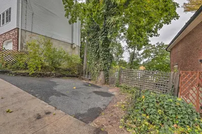 a driveway in front of a house with a fence at Historic Home in Lambertville Walk to Bridge in Lambertville