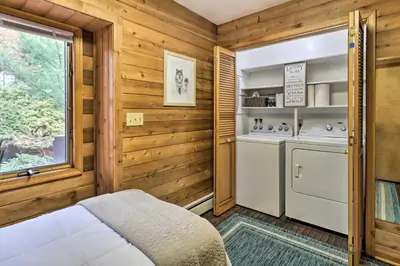 a kitchen with a washer and dryer in a room at Outdoor Theater, Deck and Fire Pit Poconos Retreat in Lake Harmony