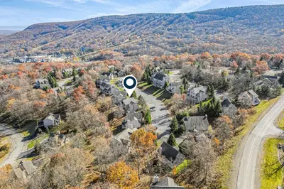 an aerial view of a residential neighborhood with trees at Northridge Retreat in Tannersville
