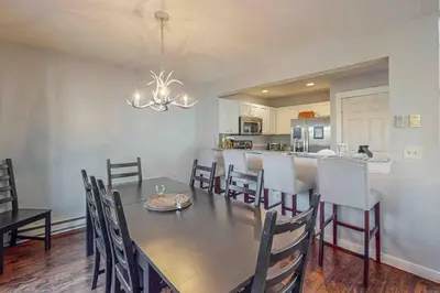 a dining room and kitchen with a table and chairs at Northridge Retreat in Tannersville