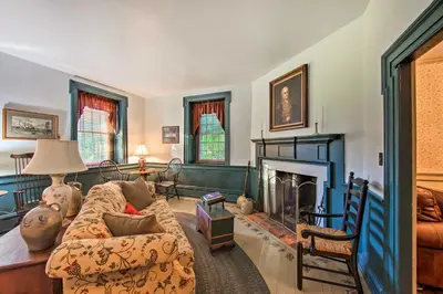a living room with a couch and a fireplace at Beautiful Historic House In Amish Country in Ephrata
