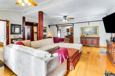 a living room with a couch and a tv at 4 Mi to Camelback! Group-Friendly Poconos Cabin in Bartonsville