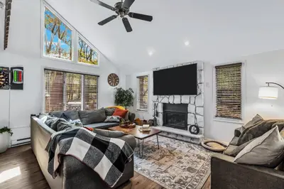 a living room with two couches and a tv at Welcome to The Mountain Escape! in Albrightsville