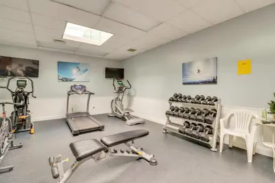 a gym with bikes and exercise equipment in a room at Community Indoor Pool Tannersville Townhome in Tannersville